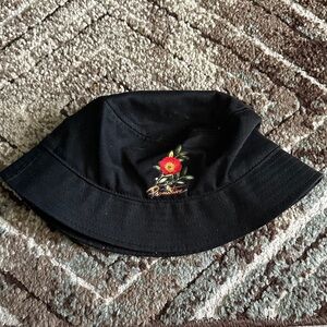 Primitive Black Hat with Red Floral Design
